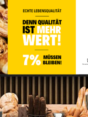 Eine Bäckerei mit einem Schild, auf dem "Denn Qualität ist mehr wert" steht.